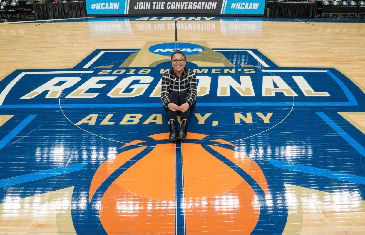 Reporter Mariana Dominguez on the court after covering the NCAA women’s college basketball tournament.